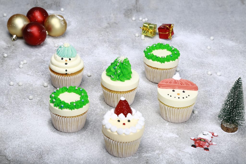 Christmas Cupcake Variety Box displayed at a party