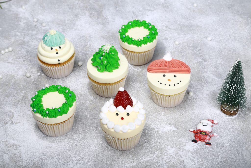 Assorted Christmas Cupcakes packaged in a transparent gift box